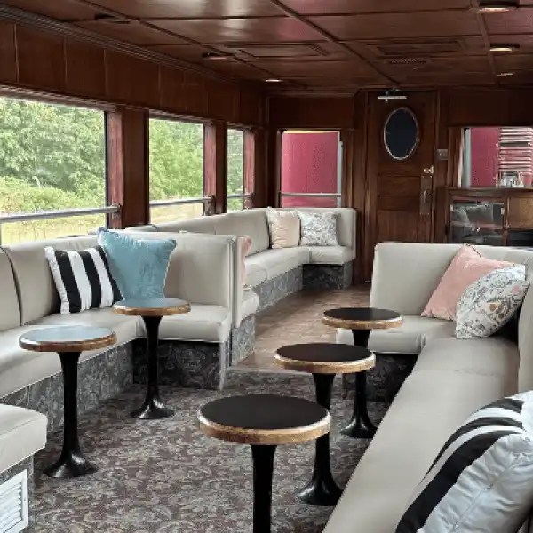 Vintage VIP lounge seating in autumn train scenic ride